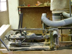 Fabrication wooden clogs with a machine. Fabrication wooden clogs with a machine.
